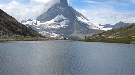 Scenic View On Snowy Matterhorn Peak And Lake Stellisee Swiss Alps