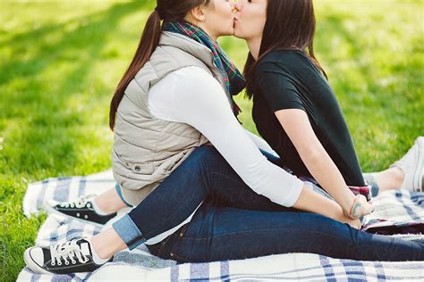 lesbian couple hanging out in the park by stocksy contributor kate ames stocksy