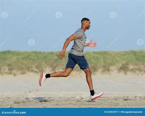 African American Man Jogging At The Beach Stock Image Image Of