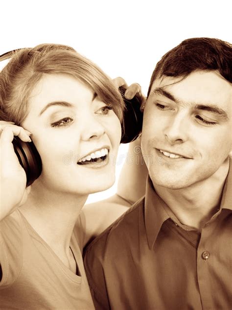 Couple Two Friends With Headphones Listening To Music Stock Photo