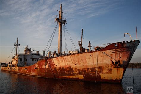 Greece Hauls Abandoned Half Sunken Ships Out Of The Sea — Ap Photos