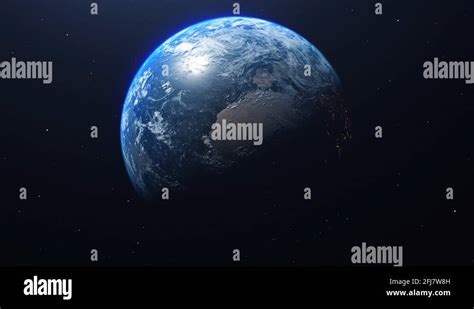 Planet Earth Rotates In Space From Day Into Night And City Lights Turn
