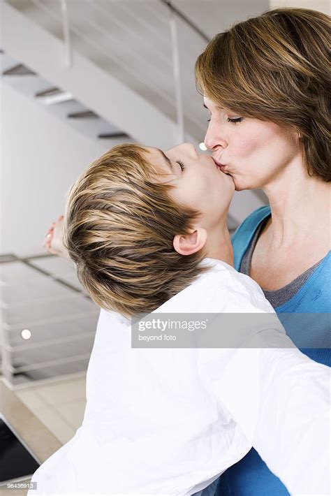 Mother And Son Kissing High Res Stock Photo Getty Images