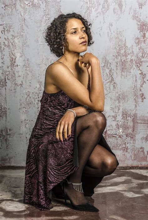 Beautiful Mulatto Woman In A Cocktail Dress With A Basket Of Fruit