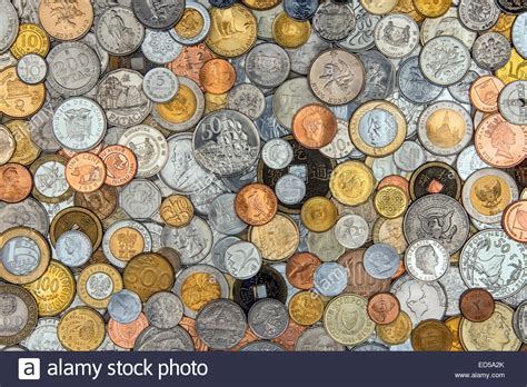 Throughout history, all kinds of things have been used as money. Currency - A collection of old coins from around the world Stock Photo, Royalty Free Image ...