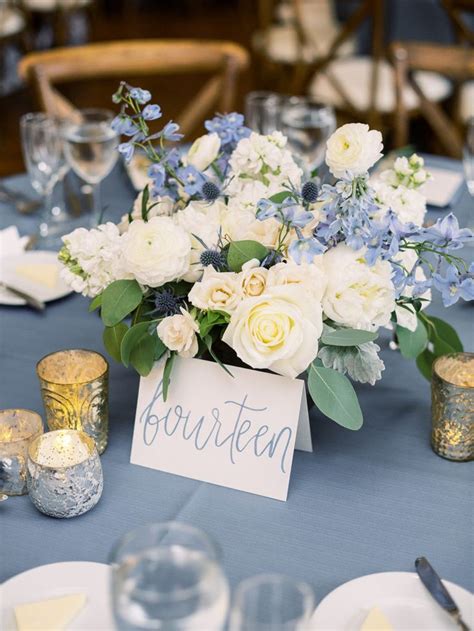 Flower Centerpiece With Blue Delphinium And Silver Mercury Glass Votives Blue Wedding