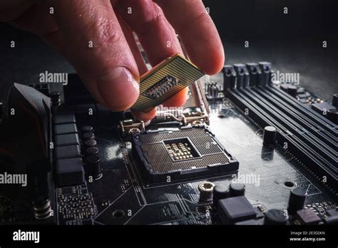 Technician Plug In Cpu Microprocessor To Motherboard Socket Workshop