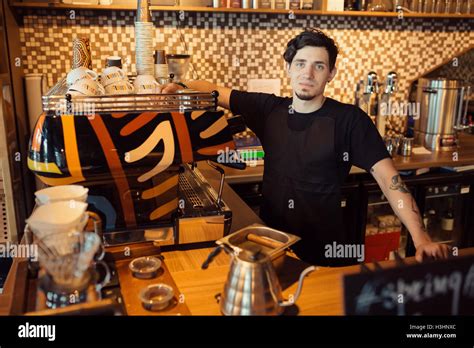 Barista at work in a coffee shop Stock Photo - Alamy