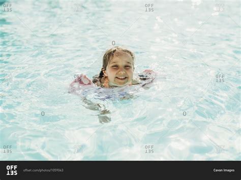 Young Preschool Age Girl Swimming In Pool On Vacation In Palm Springs