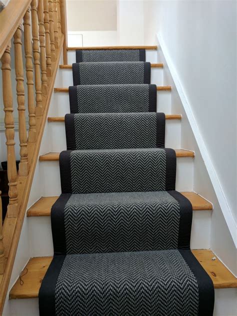 This increasingly popular colour is perfect for being used as a neutral background and can help other more vibrant colours in the room stand out. Black & Grey Herringbone stair runner with black binding by B&R Carpet Company #carpet #stairs # ...