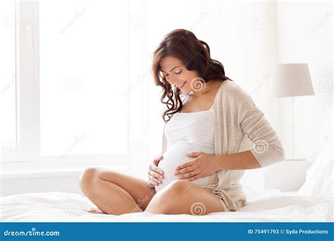 Happy Pregnant Woman Sitting On Bed At Home Stock Image Image Of