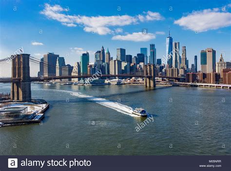The Brooklyn Bridge And Lower Manhattan Skyline Seen From Across The