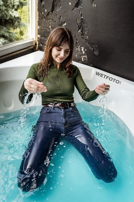 Hot Lady Takes A Bath In Blue Skinny Jeans And Gets Completely Wet