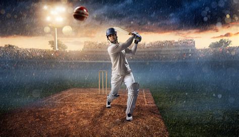 Cricket Batsman On The Stadium In Action Stock Photo Download Image