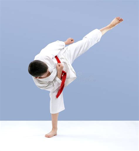 Karate Athlete Hits A Kick On A Light Background Stock Image Image Of