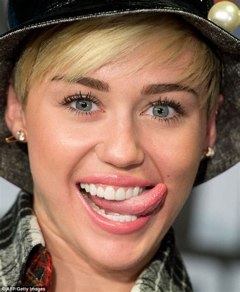 Miley Cyrus Flashes Bra As She Visits London Daily Mail Online