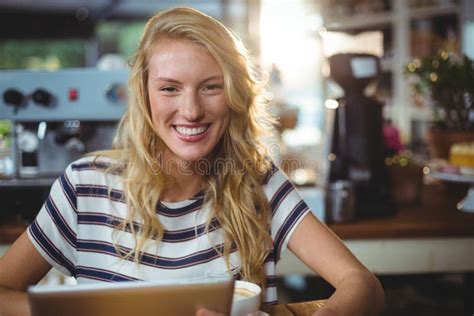 Woman Sitting In A Cafe Using Digital Tablet Stock Photo Image Of