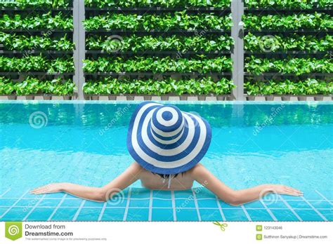 Young Asian Woman Relaxing In Swimming Pool At Spa Resort. Relaxing Concept. Women Are Relaxing ...