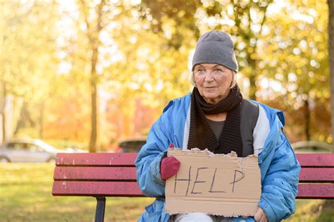 Homeless Or Poverty Stricken Elderly Lady Stock Photo Download Image