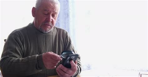 Old Grandpa Uses A Smartphone Stock Video Envato Elements