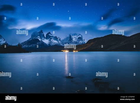 Breathtaking scenery of tranquil lake under clear starry sky against