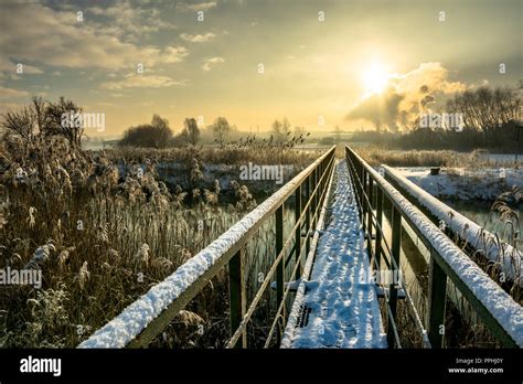 Winter Landscape With Footbridge Across River Modern Architecture In