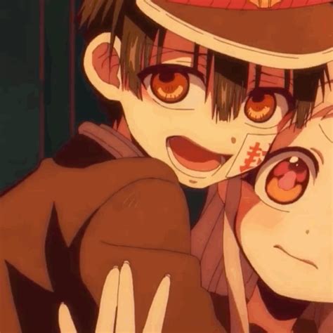 Two Anime Characters Are Hugging Each Other With Their Eyes Wide Open And One Is Wearing A Hat