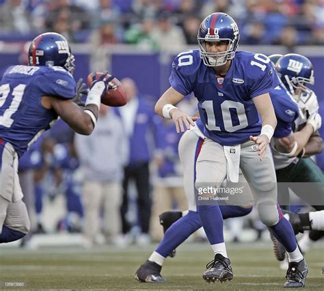 New York Giants Quarterback Eli Manning 10 Pitches The Ball Out To
