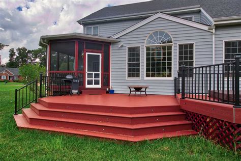 The hendrick house plan 2467: Custom Red Deck with Blue House - Deck Creations | Outdoor ...
