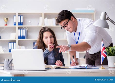 The Teacher Explaining To Student At Language Training Stock Photo