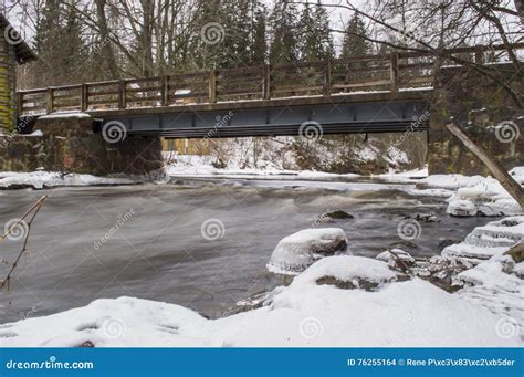 River Flowing Under Bridge Stock Photo Image Of Water 76255164