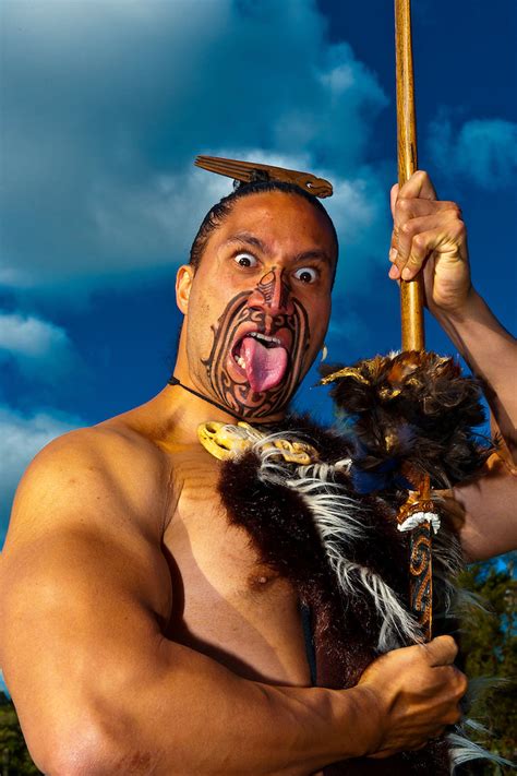 A Maori Warrior With A Ta Moko Facial Tattoo Performs A War Haka