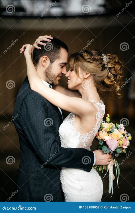 Young And Beautiful Bride And Groom Embrace Stock Photo Image Of Love
