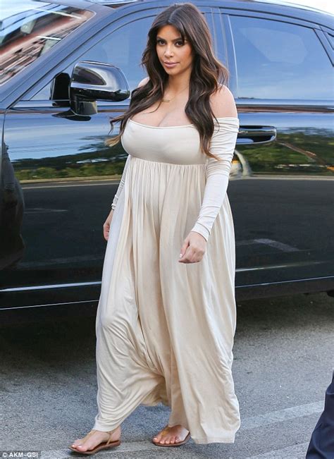 Kim Kardashian Struggles To Contain Her Famous Curves In A VERY Revealing Maxi Dress Daily