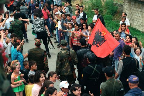 Members Of The Local Kla Kosovo Liberation Army March Through The