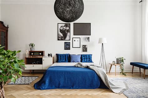 Style a side table or nightstand with the elysia table lamp. Black Chandelier In Navy Blue Bedroom In Tenement House ...