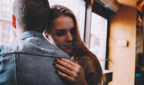 Portrait Of Beautiful Young Couple In Love At A Coffee Shop Stock