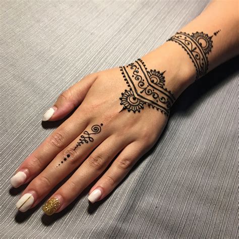 Small Henna Tattoo On Hand