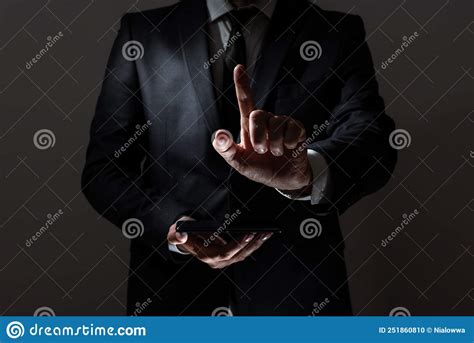 Businessman Holding Tablet And Pointing With One Finger On Important