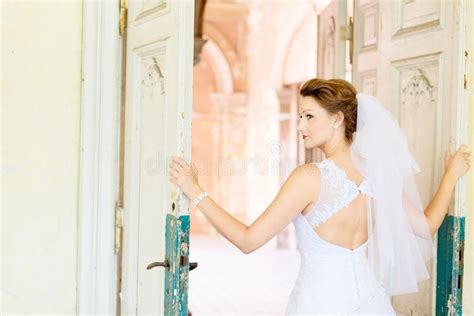 Young Beautiful Bride In White Dress Near Old Door Stock Image Image