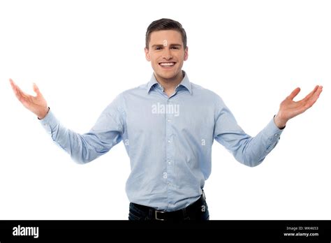 Smiling Man Standing With Open Arms Welcome Gesture Stock Photo Alamy