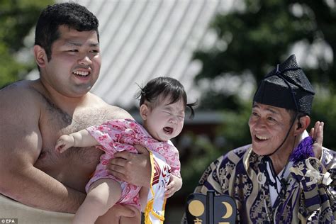 Hulking Sumo Wrestlers Try To Make Babies Cry At Japanese Festival