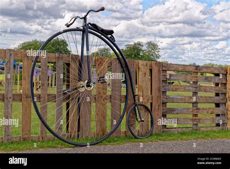 Antique Vintage Bicycle Parked On A Wooden Fence United Kingdom Stock