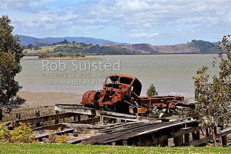 Old Truck Rusting Away On Old Wharf On The Hokianga Harbour Amongst