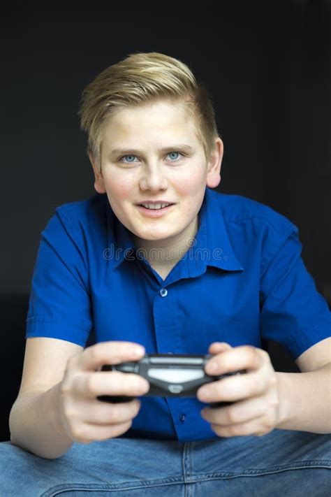 Straight On View Of Boy Playing A Video Game Stock Photo Image Of