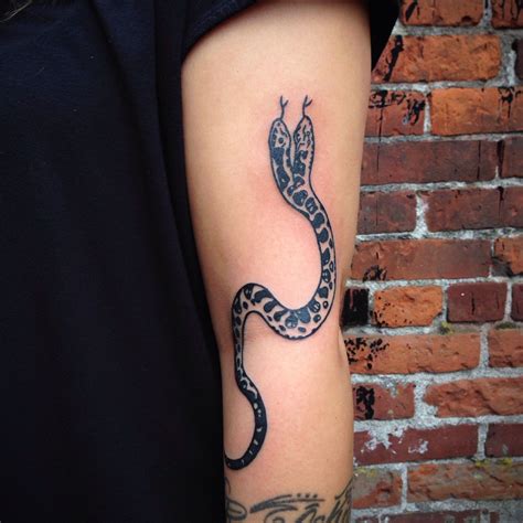 It also signifies that the man who bears it does not fear such changes, nor does he fear death. Ripley's two headed snake #tattoo #snake