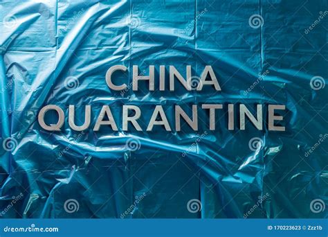 The Words China Quarantine Laid With Silver Metal Letters On Crumpled