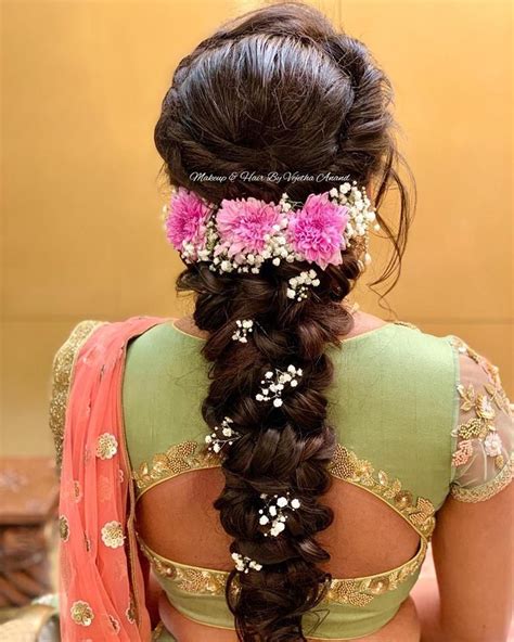 These buns make for great wedding hairstyles for curly hair. Gorgeous romantic bridal hairstyle by MUA Vejetha Anand ...