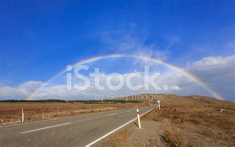 Beautiful Full Double Rainbow Over Road And Mountain Stock Photos