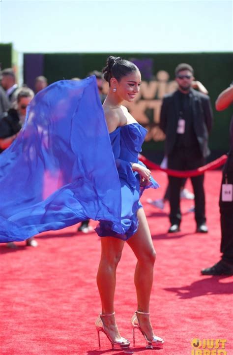 A Woman In A Blue Dress On The Red Carpet